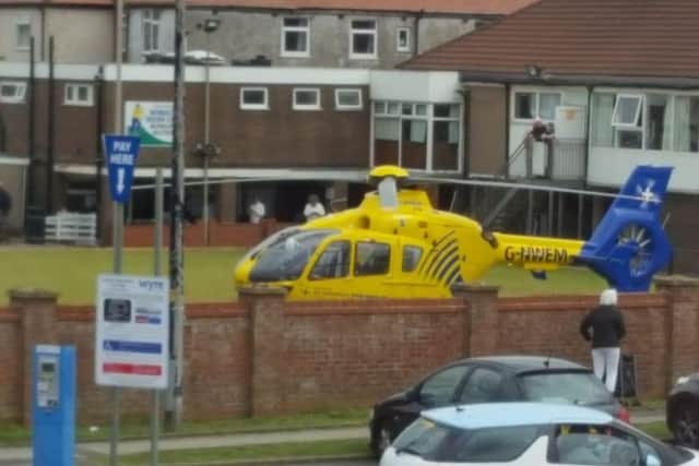 An air ambulance has landed at the bowling green at Cleveleys Working Men's Club after a person was reported injured at a nearby car park.