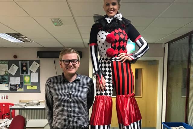 Gazette reporter James Graves with Natalie O'Brien, stilt walker from Abstract Entertaiment
