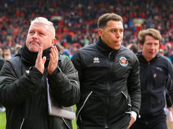 Terry McPhillips applauds the Blackpool fans at full time