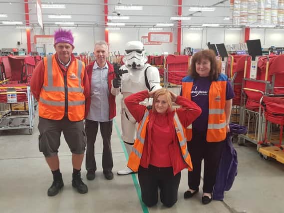 Stormtrooper Darren with Royal Mail staff and Liz McGuinness from Kidney Research UK