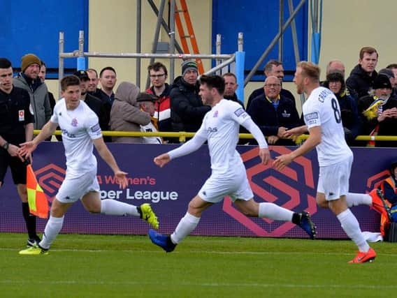 Fylde celebrate Danny Philliskirk's (left) winning goal at Solihull Picture: STEVE MCLELLAN