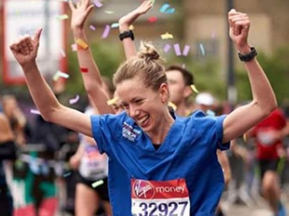 Jessica Anderson running the London Marathon in her Nurses uniform.