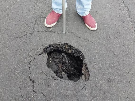 A deep pothole on Flakefleet Ave