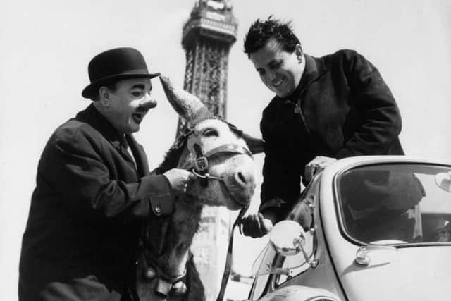 Clown Charlie Cairoli from the Blackpool Tower circus and his donkey wishes Andre Baldet of Northampton good luck for his 48 hour drive to Paris and back in a Trojan Lambretta bubble car.   (Photo by Keystone Features/Getty Images)
