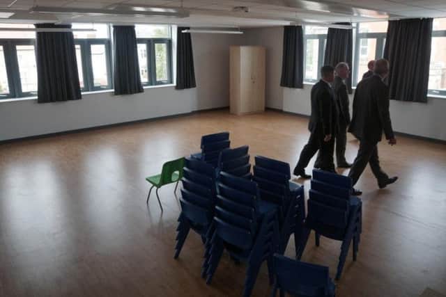 Senior teachers looking around the Armfield Academy when the keys were handed over by contractors last year