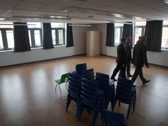 Senior teachers looking around the Armfield Academy when the keys were handed over by contractors last year