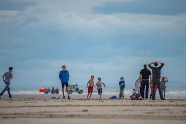 Families enjoy a day on the beach in Blackpool