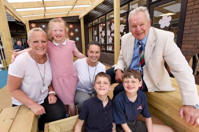 Sir Bill Beaumont with pupils at the playground opening