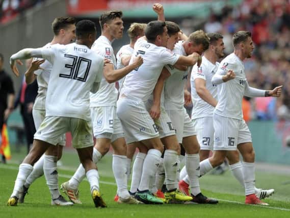 The AFC Fylde team celebrate Danny Rowe's goal against Leyton Orient in the FA Trophy Final at Wembley