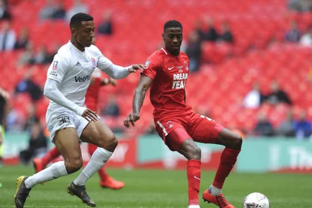 AFC Fylde's Alex Reid challenges Leyton Orient's Marvin Ekpiteta