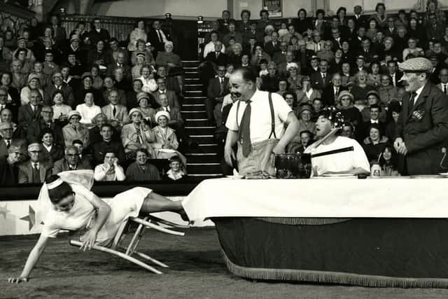 Charlie Cairoli and Jimmy Buchanan (centre) during their wedding day routine at the Blackpool Tower Circus in 1965. Picture by Barnet Saidman