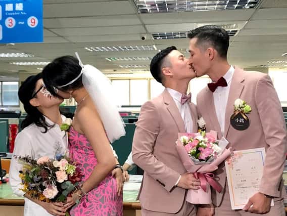 Hundreds of same-sex couples in Taiwan are rushing to the household registration office on the first day that a landmark decision to legalize same-sex marriage has taken effect.