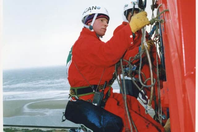 The red tubular track and supports were airlifted from Bolton to Blackpool and stored at nearby Blackpool Airport. Workmen are pictured putting the finishing touches to the paintwork.