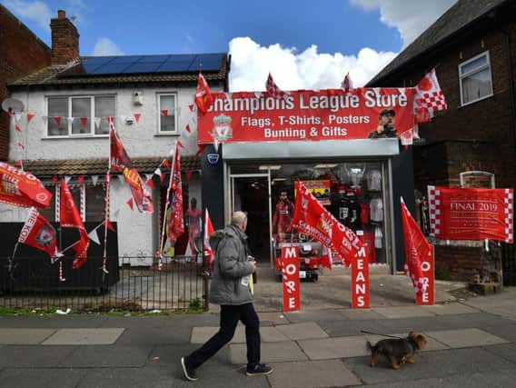 A shop sells Liverpool merchandise for the upcoming Champions League final in Liverpool (ANTHONY DEVLIN/AFP/Getty Images)