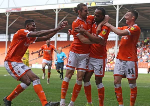 Nathan Delfouneso will stay with Blackpool after signing a new deal