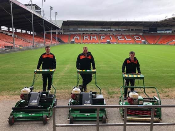 Blackpool's grounds team show off the new mowers. From left to right, Jonny Cardwell, Harry Bradley and Kane Roberts