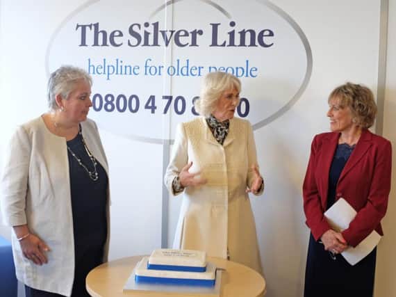 The Duchess of Cornwall meets CEO Sophie Andrews and founder Esther Rantzen at the offices of The Silver Line.