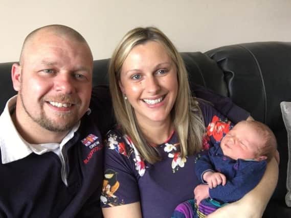 New dad Martyn with wife Ann and son Harry