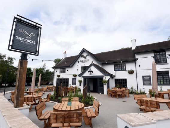 Outside the pub, which has reverted to its 16th Century name from The Eagle and Child, has been redecorated and new signs, lighting and planters installed.