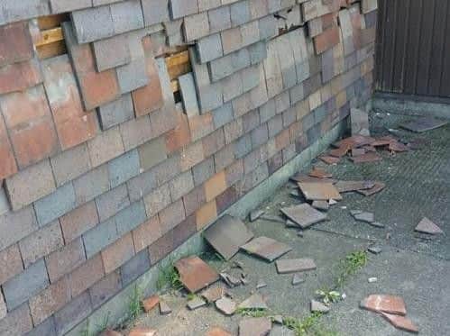 Damage to the wall tiles.