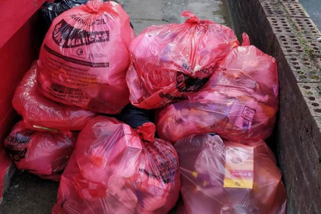A pile of red bin bags left off Dickson Road, Blackpool town centre, on Monday, June 17, 2019