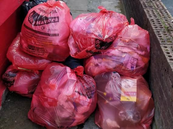 A pile of red bin bags left off Dickson Road, Blackpool town centre, on Monday, June 17, 2019
