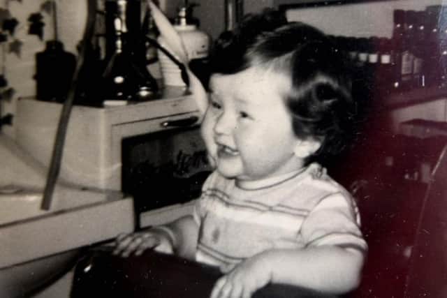 Paul Dunstan aged three at his dad Roy's barbers just further up Red Bank Road