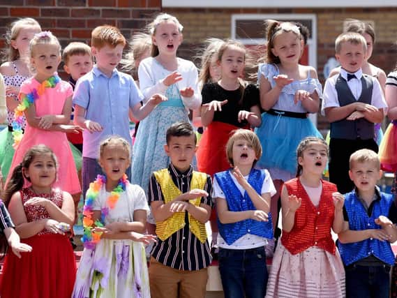 Staff and pupils at Kincraig Primary School celebrate the Queen's reign by having a tea party and performing songs for parents