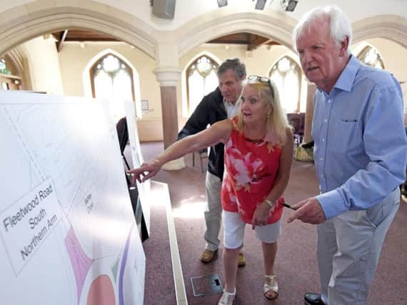 Stephen and Maria Cassidy discuss the plans for the Norcross Roundabout works with John Bailie at at Thornton Methodist Church.