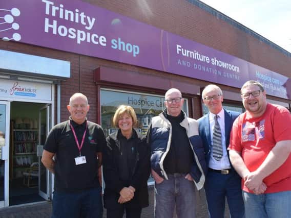 Trinity Hospice's head of retail, Paul Guest (second right) with staff at the Donation Centre on Talbot Road, Blackpool.