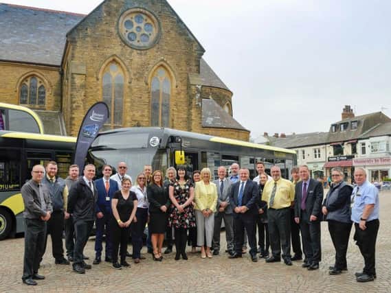 Celebrating the launch of the new buses