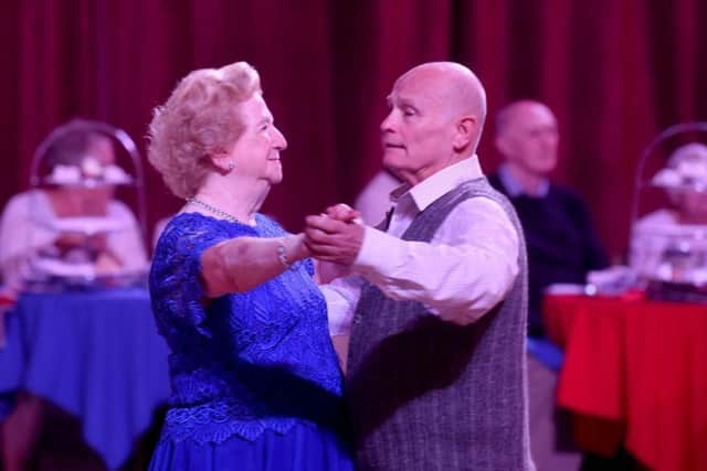 A couple enjoys dancing at the historic ballroom