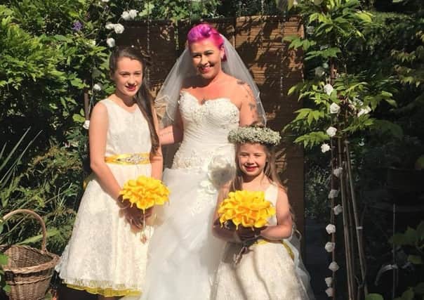 Natale McDonald with her step-daughter Kealy, 13, and daughter, Eleanor, eight, on Natales wedding day. They will wear the same outfits for Colour Splash i2019 n memory of Natales Grandma, Marie Donaldson.