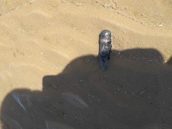 A picture of the suspect device lying on the sand earlier