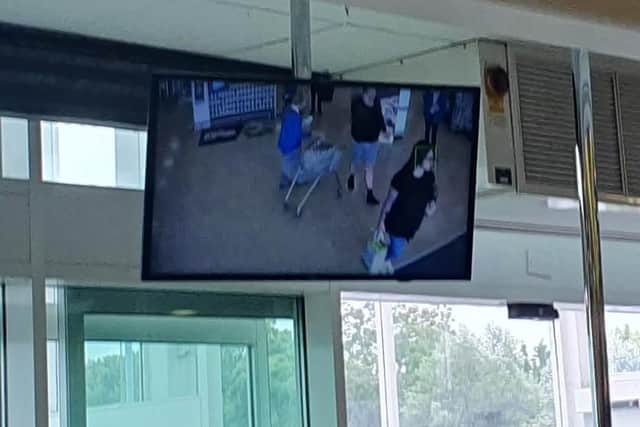 A screen at the supermarket shows a feed from the CCTV cameras