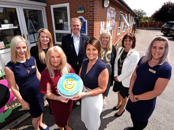 Hayley Howarth, Melissa Hoyle, David Hoyle, Sophie Mellor, deputy mayoress of Wyre Colette Birch and Faye McCulloch with founder and director Jackie Hoyle and operations manager Catherine Rosenfield with the cake
