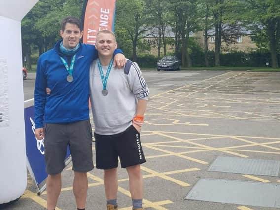 Robert McLeod (left) and Gavin Goulds after completing the overnight fundraising hike in the Peak District