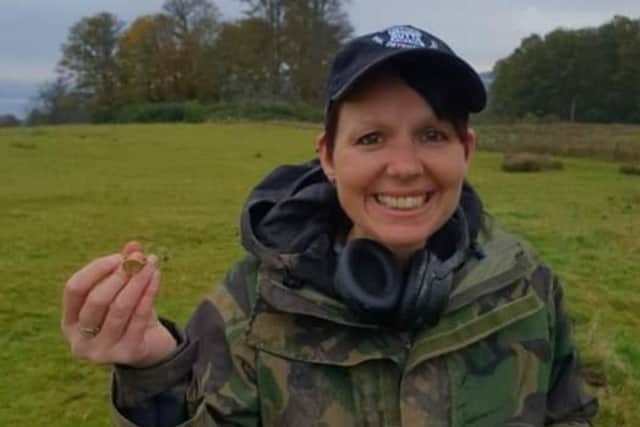 Michelle Vall with the ring she found while metal-detecting