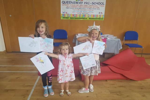 The young winners of a colouring competition to mark the launch of SJ Dawson's Rainbow Dust