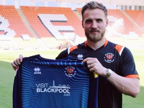 Jak Alnwick became Blackpool's seventh signing of the summer yesterday