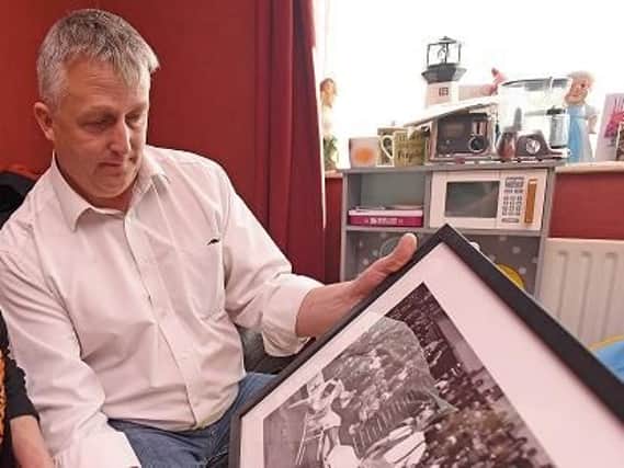 Nigel Male with a framed photo of his idol, Charlie Cairoli