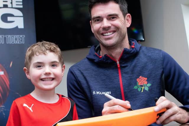 James Anderson signs autographs and poses for photos with young cricketers at Blackpool Cricket Club