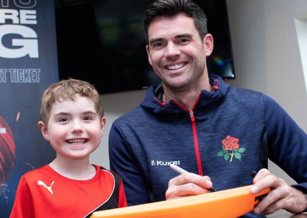 James Anderson signs autographs and poses for photos with young cricketers at Blackpool Cricket Club