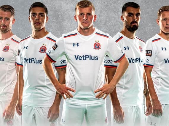 AFC Fylde players model the club's new home kit