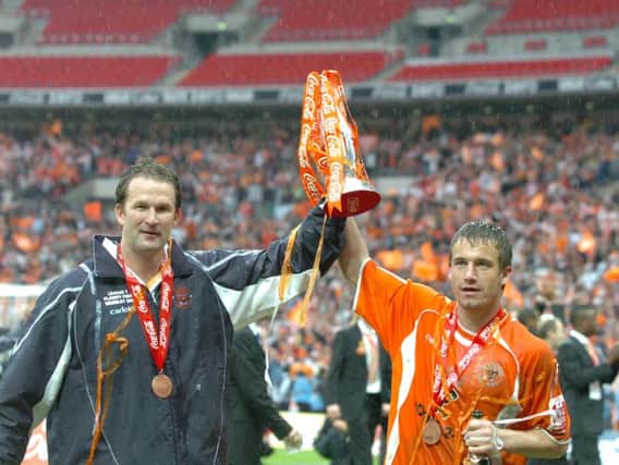 Simon Grayson lifts the trophy with Keigan Parker