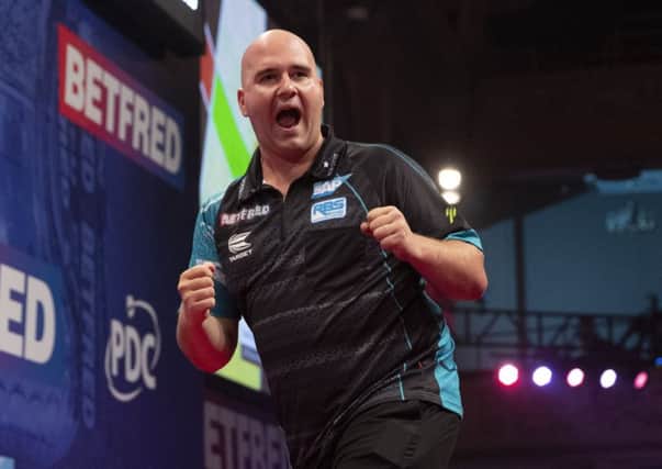Rob Cross booked his place in the final four     Picture: Lawrence Lustig/PDC