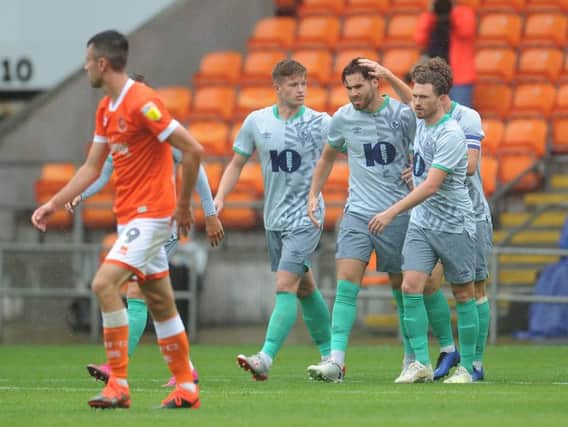 Ben Brereton is congratulated by his Blackburn teammates after scoring their second goal of the game against Blackpool