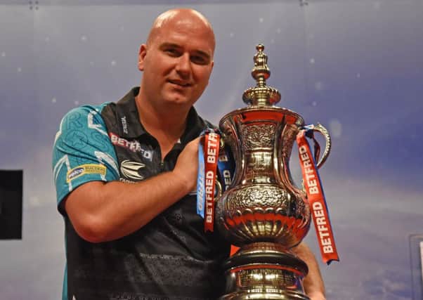 Rob Cross celebrates winning the Phil Taylor Trophy at the Winter Gardens      Picture: Chris Dean/PDC