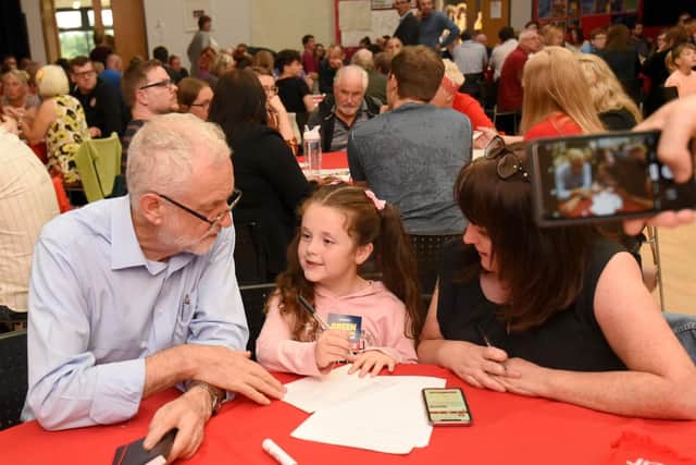 Jeremy Corbyn  meets seven-year-old Grace Cooper.at the Green Industrial event at St Mary's Catholic Academy.