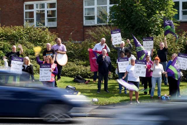 Cleaners at Blackpool Victoria Hospital on strike in protest at unfair pay rates.